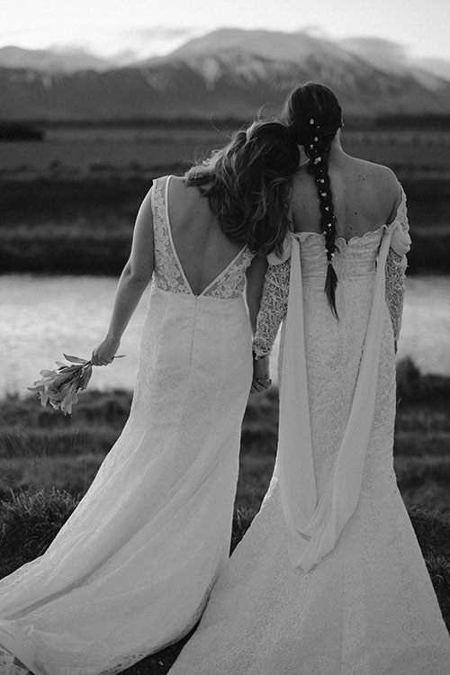 Female elopements photos in wedding dresses