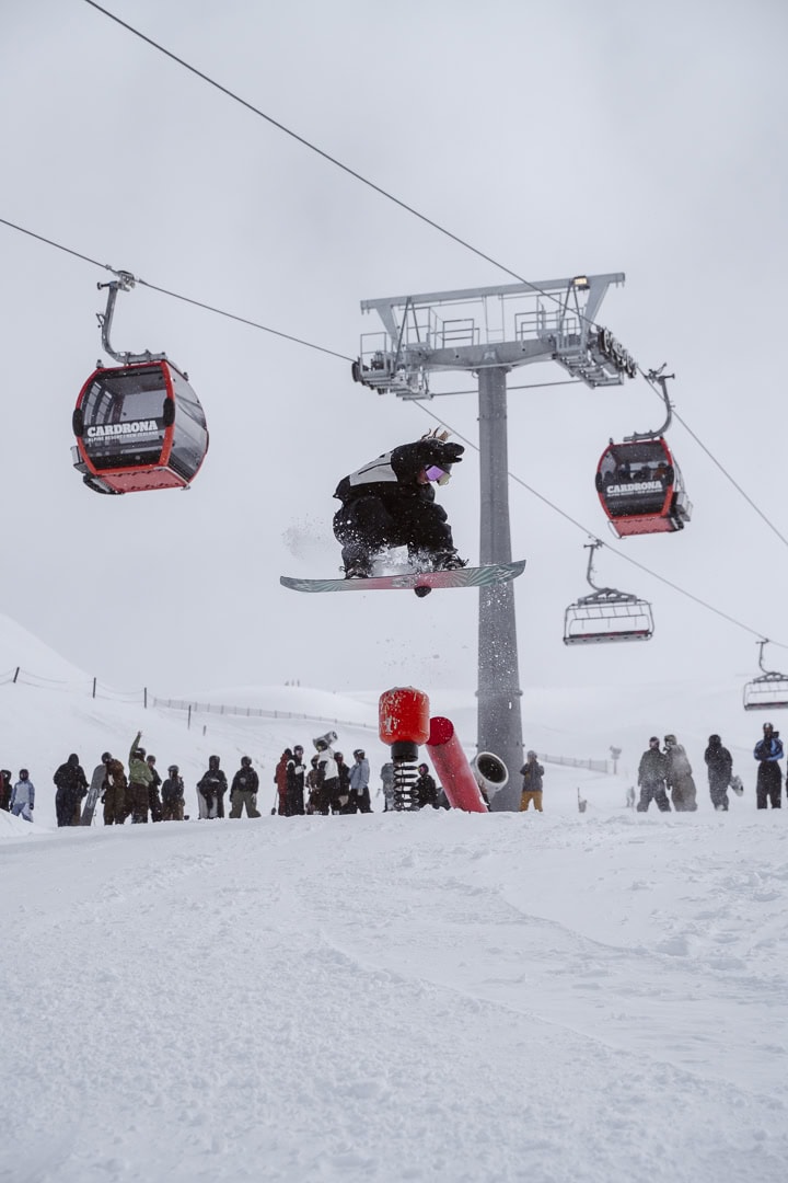 Snowboarding grabbing board.